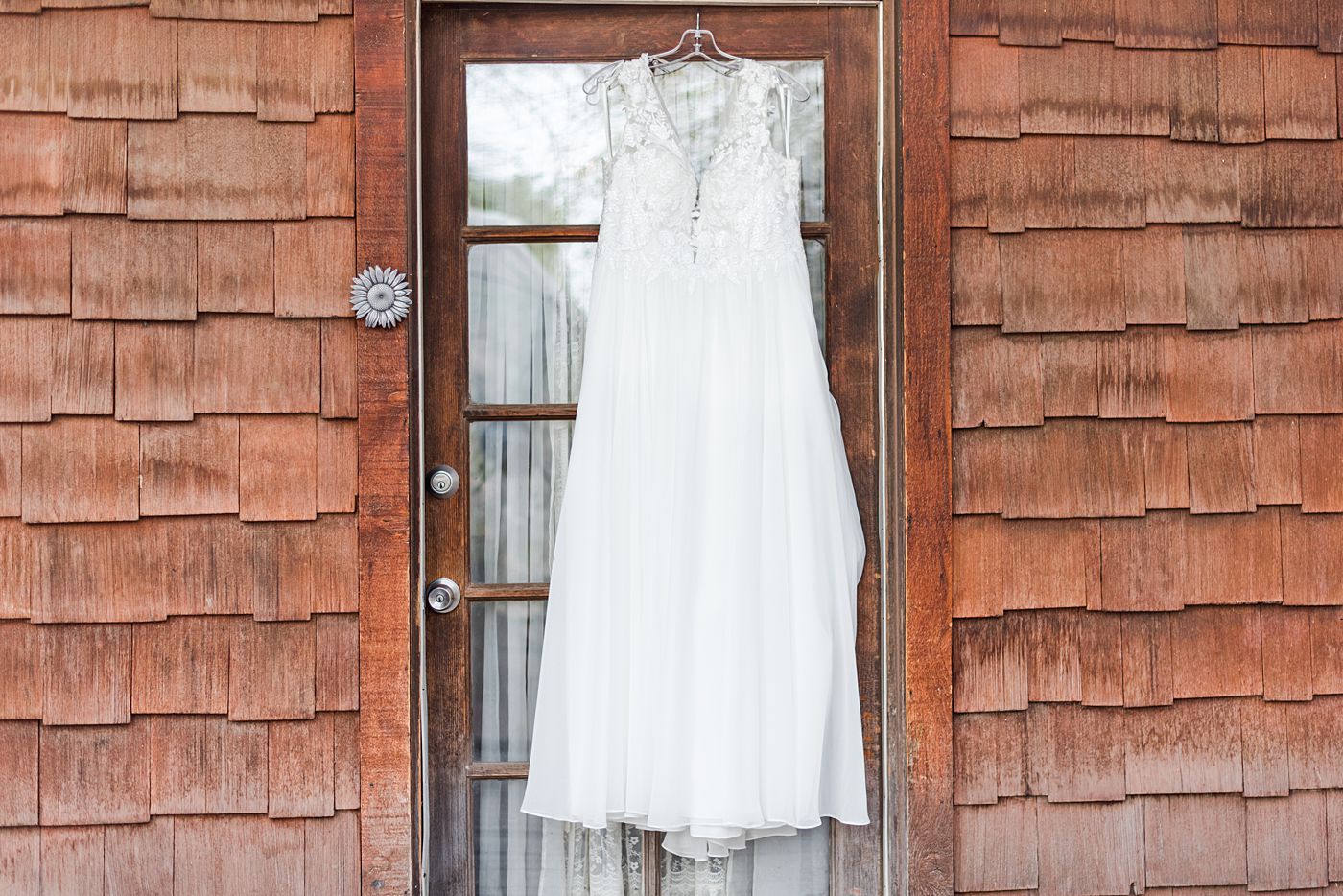 a white wedding gown hanging