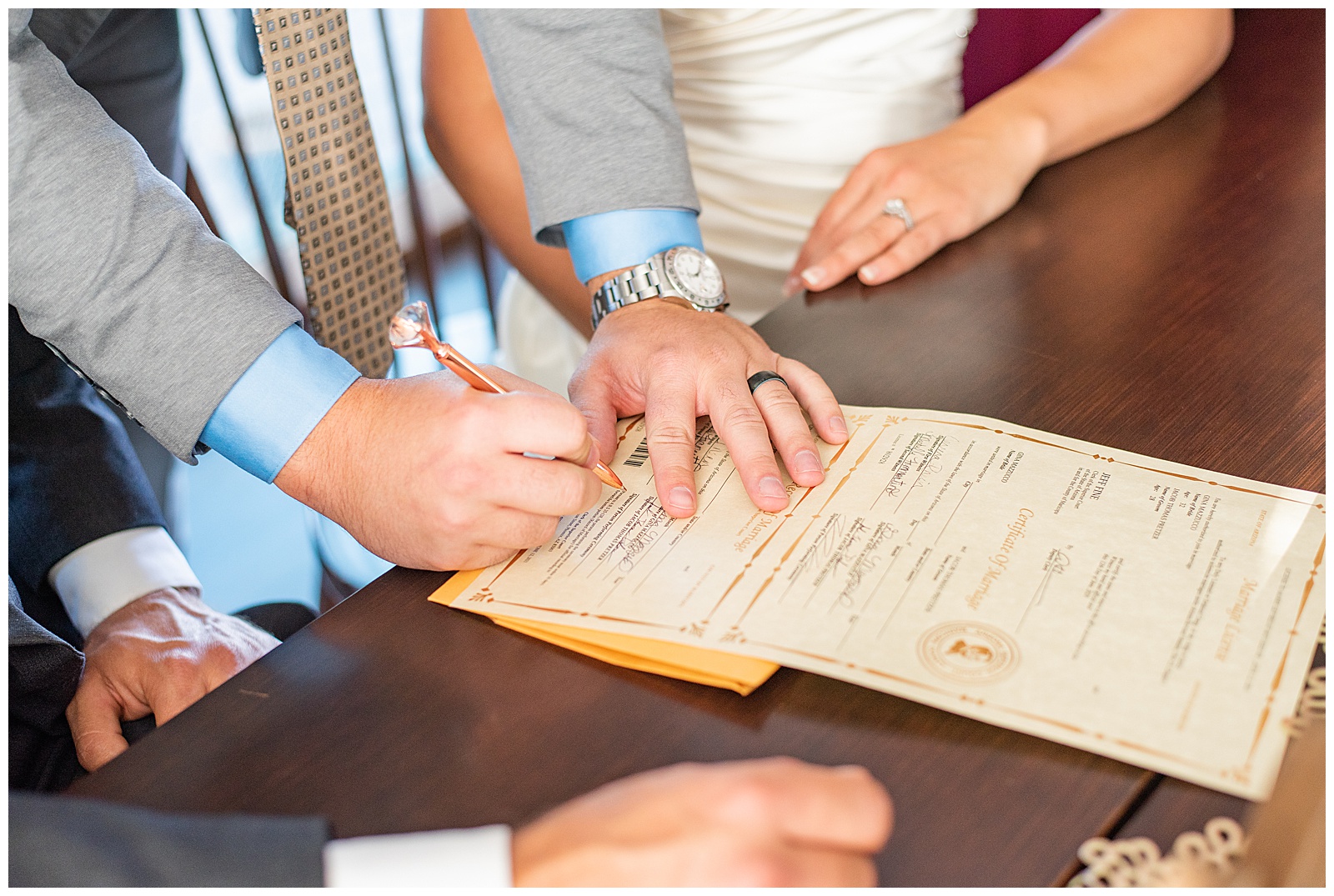 bride and groom signing marriage license at Prescott Arizona wedding venue