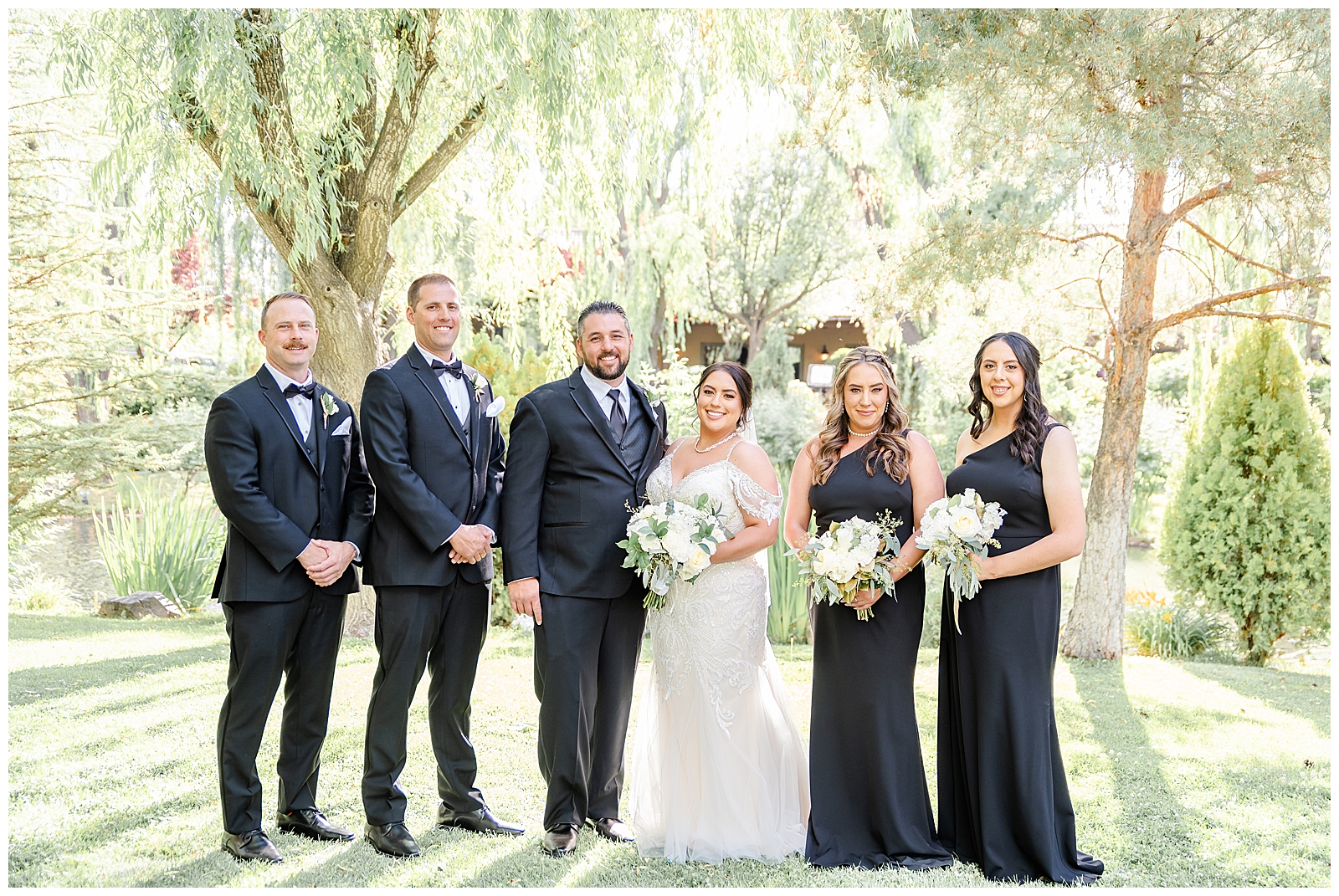 a bridal party standing together outside