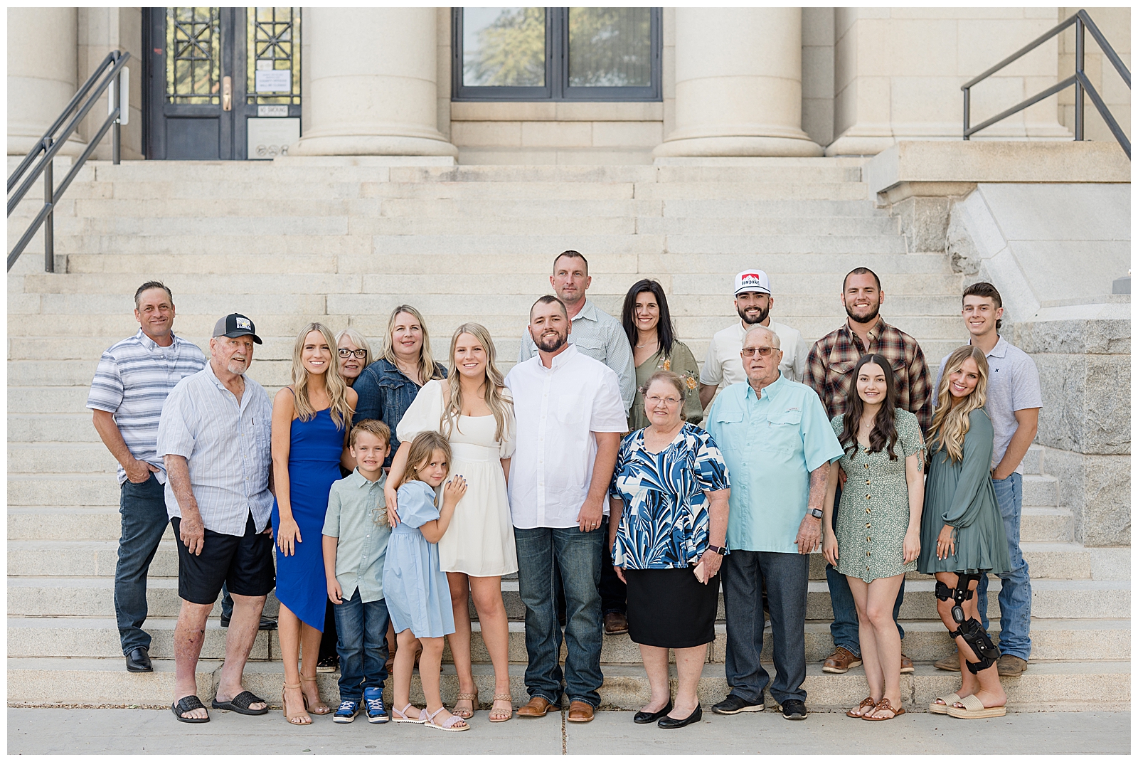 group of people standing in front of large steps outdoors