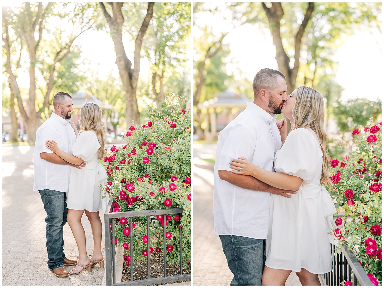 man and wife wearing white standing on green grass in park in front of red roses